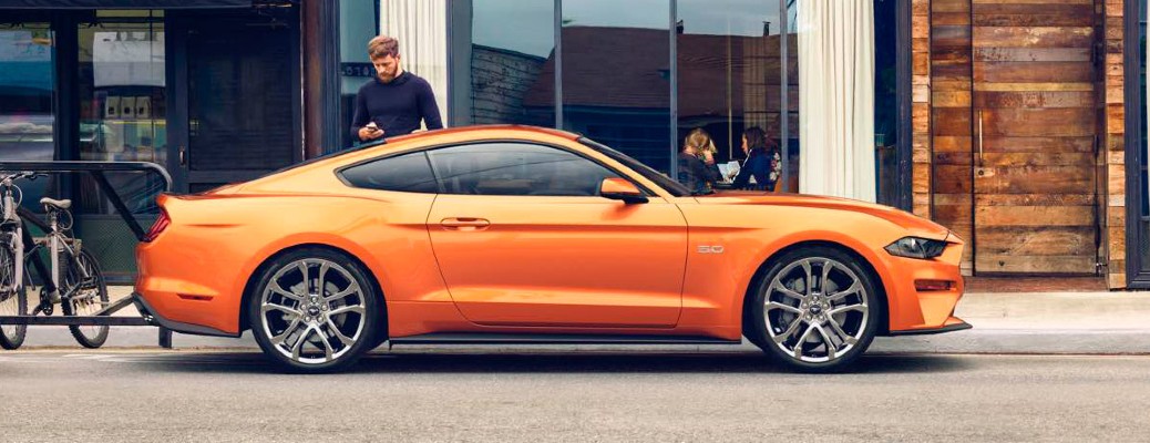 2018 Ford Mustang side view in orange