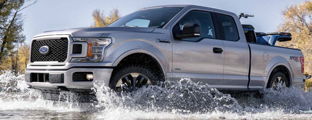 2018 Ford F-150 side view driving in water