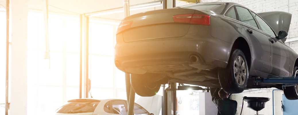 a car lifted in the air for service