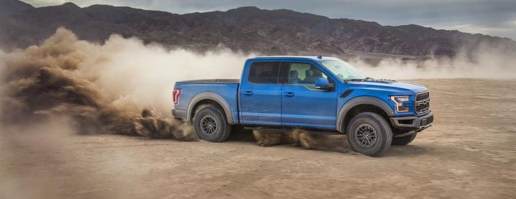 2019 Ford F-150 truck side view in sand