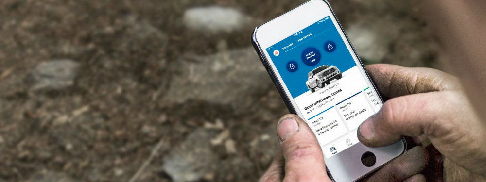 Man operating Ford SYNC Connect app from iPhone