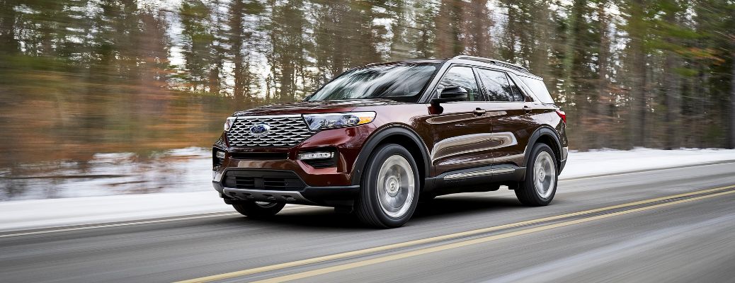 2020 Ford Explorer driving on a snowy forest road