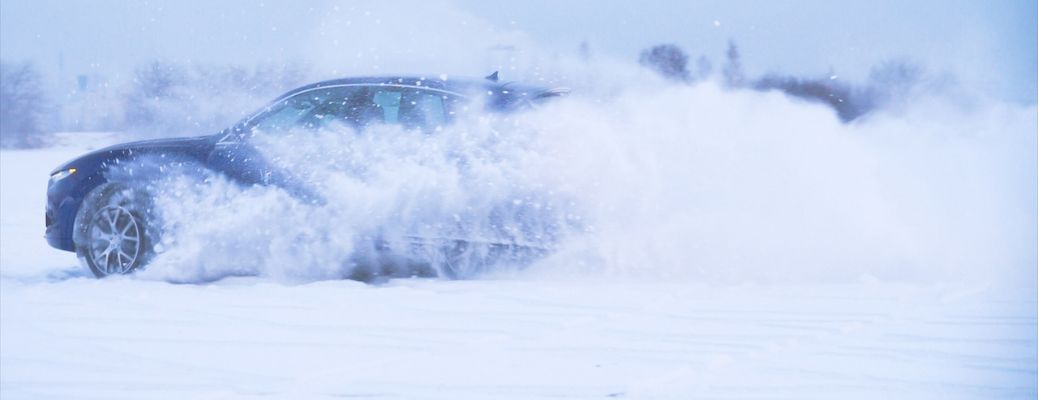 a car driving in snow in winter