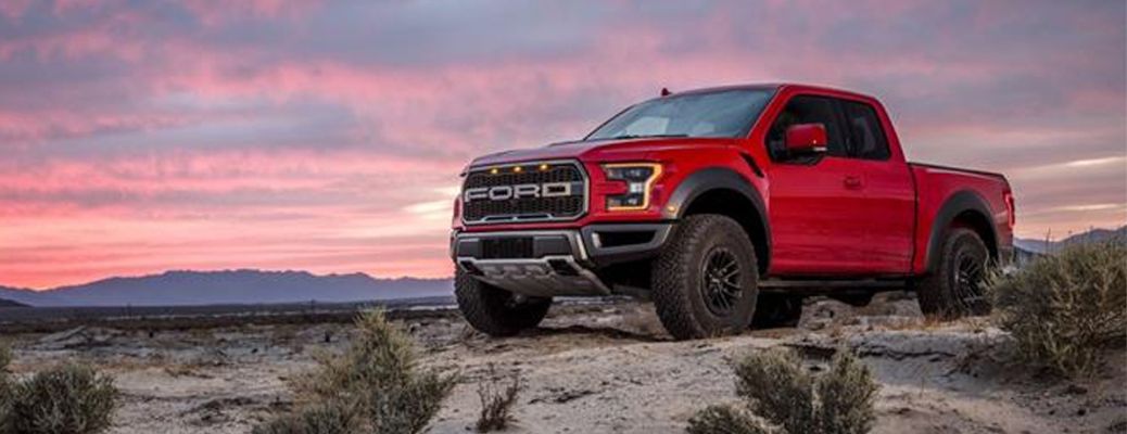 Red 2019 Ford F-150 Raptor parked overlooking desert