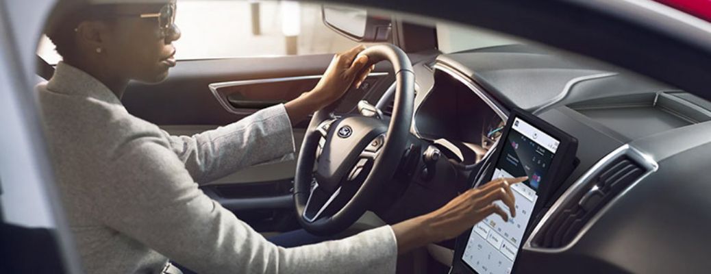 2021 Ford Edge SUV with a driver inside