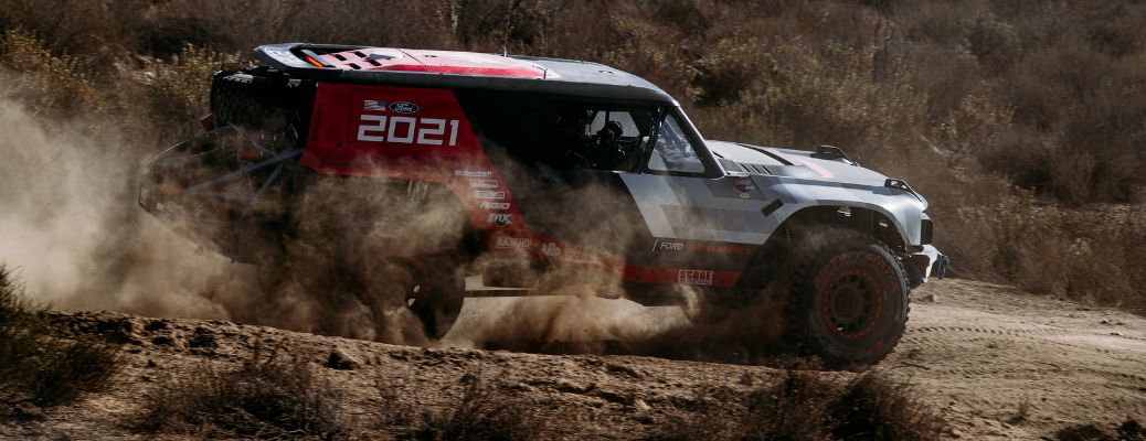 Ford Bronco R side view driving in dirt