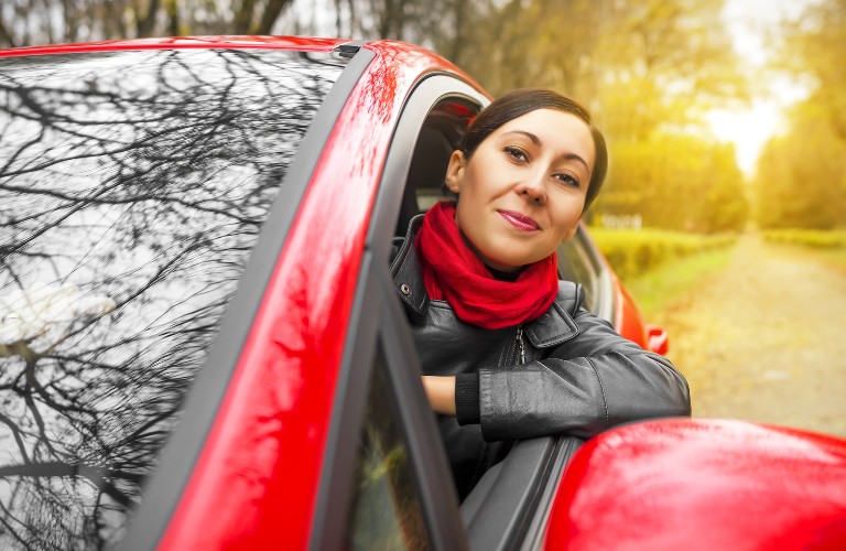 Woman in a red car