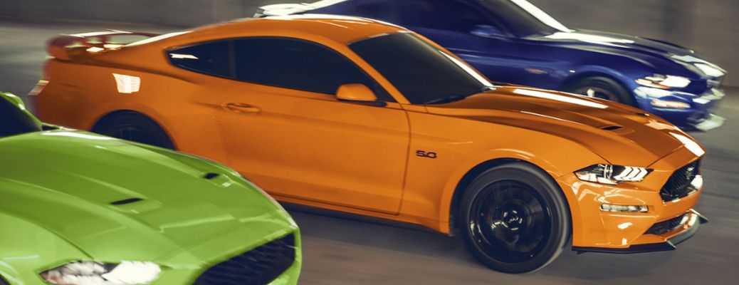 three 2020 Ford Mustang cars in a row