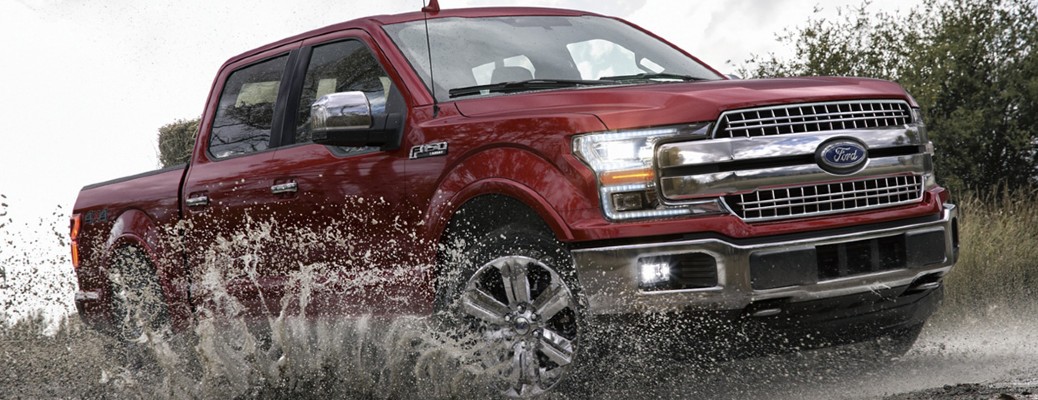 2020 Ford F-150 front and side view driving in mud