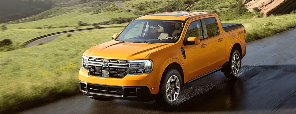 2022 Ford Maverick with orange paint on a road