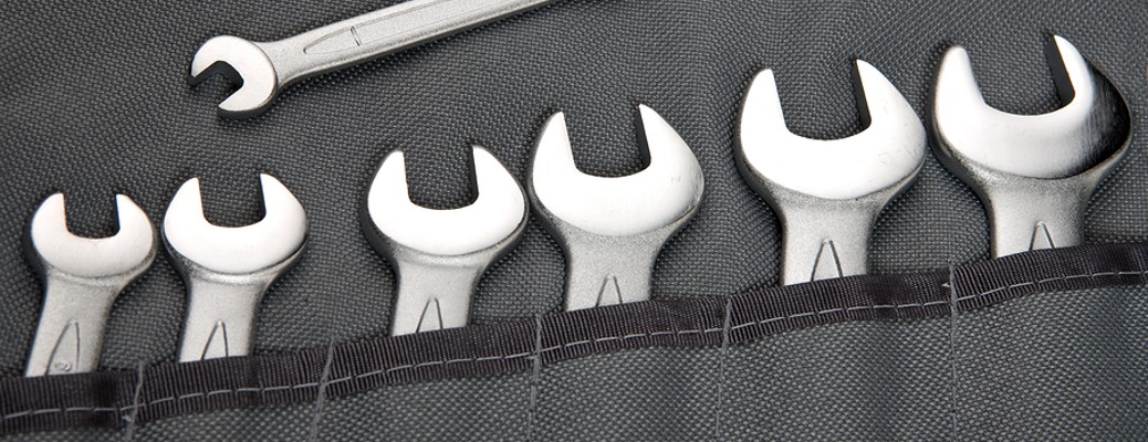 a selection of wrenches in small pockets