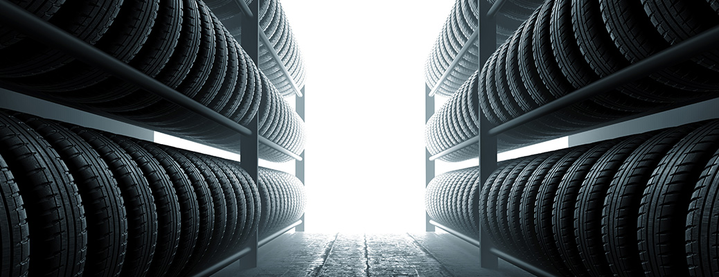 two racks of tires with light shining between