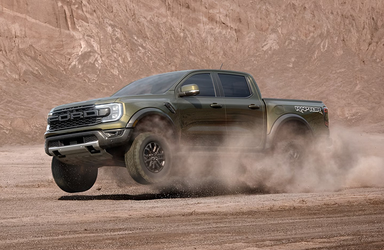 2024 Ford Ranger Raptor driving in sand