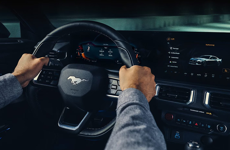 2024 Ford Mustang steering wheel with two hands