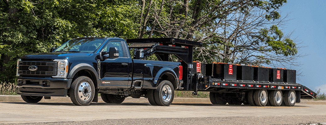 2023 Ford Super Duty with a flatbed trailer