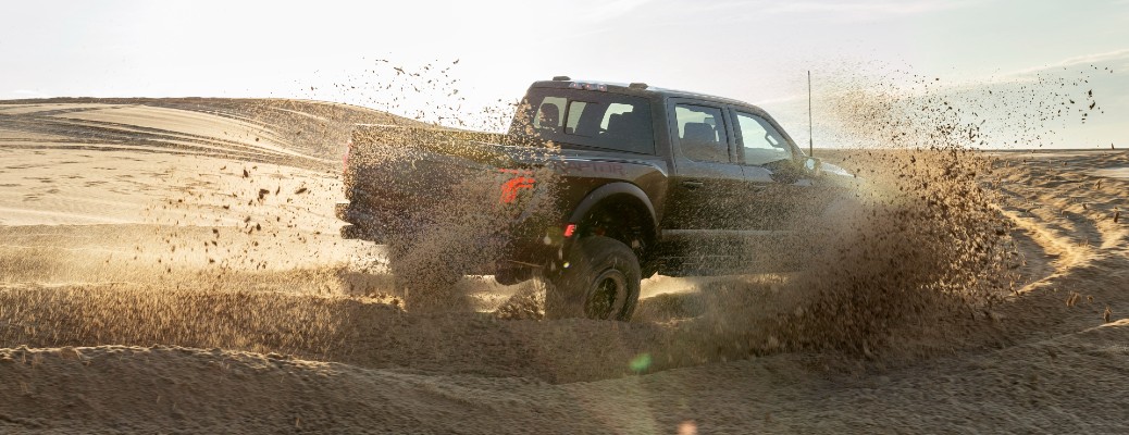 2024 Ford F-150 Raptor driving in sand
