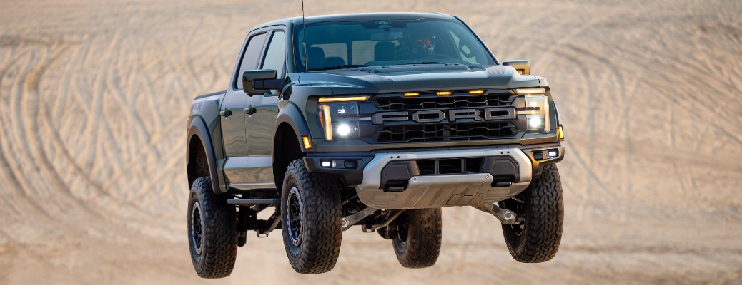 2024 Ford F-150 in the air above a sandy ground