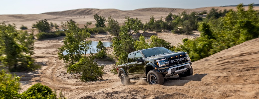 2024 Ford F-150 Raptor driving up a hill