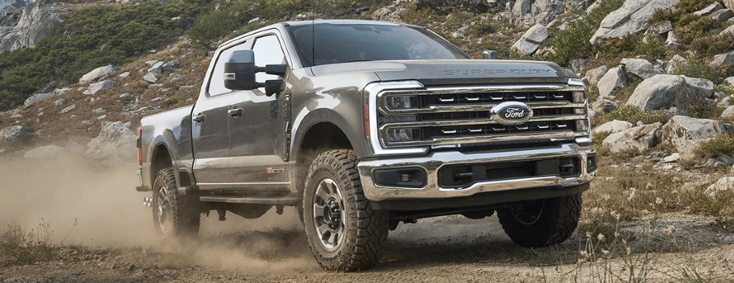 2024 Ford Super Duty driving on a dirt road