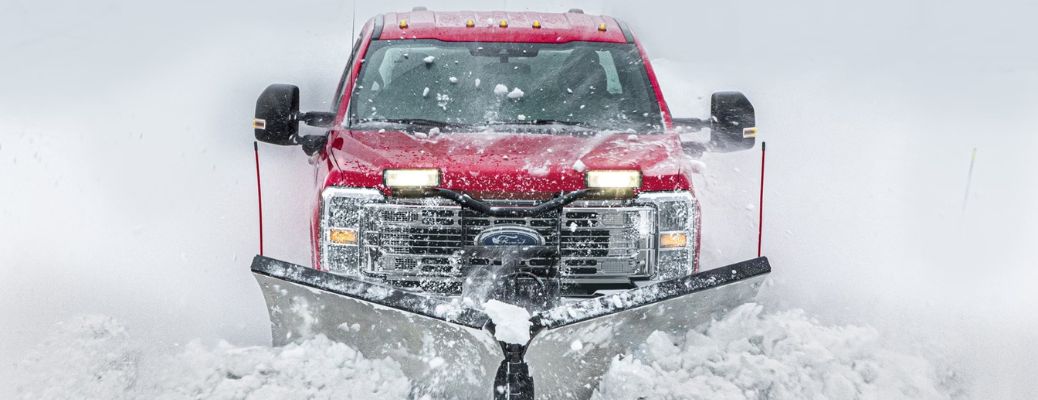 2024 Ford Super Duty truck plowing snow