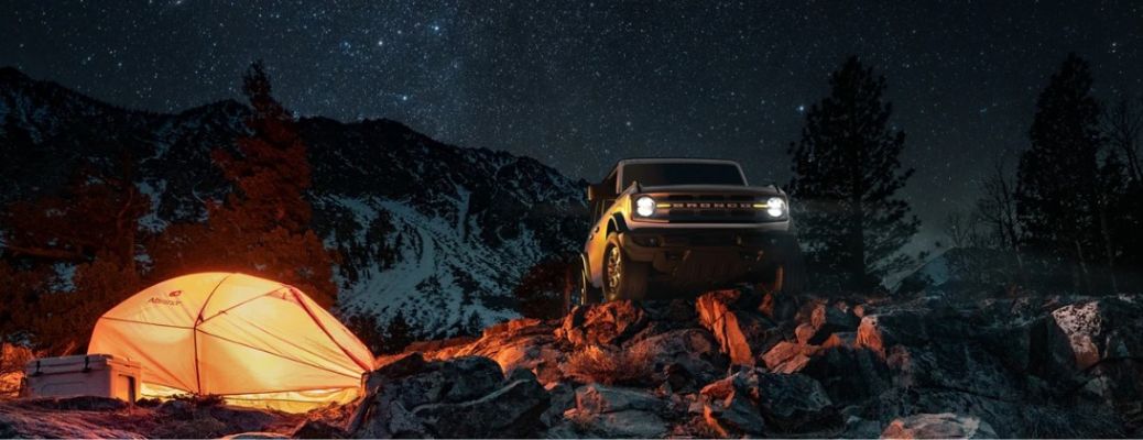 2024 Ford Bronco by a lit tent at night