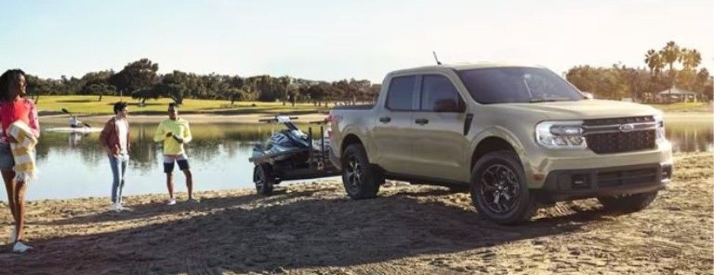 2024 Ford Maverick truck front view parked off-road by a lake