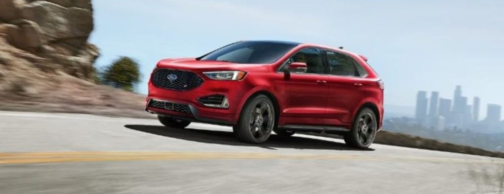 2024 Ford Edge red paint driving on a road