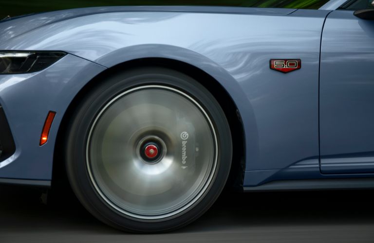 Ford Mustang 60th Anniversary Package wheel and tire in motion close up