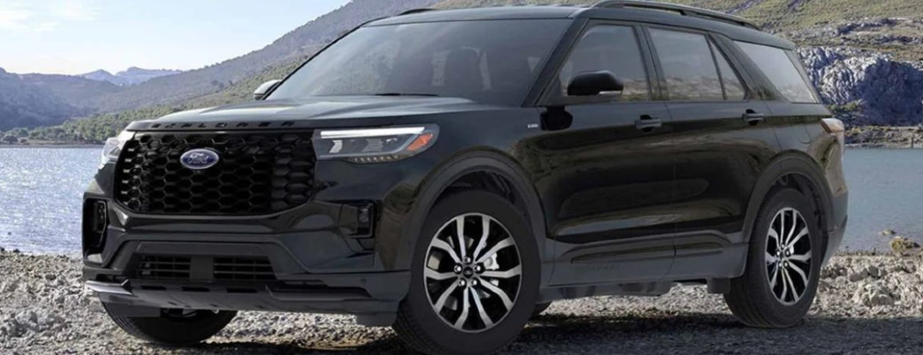 2025 Ford Explorer ST-Line side view in black on a rocky beach
