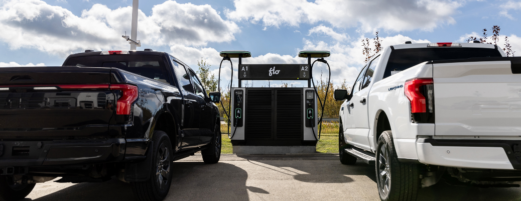 Two trucks charging at a DC fast charger at Sherwood Ford
