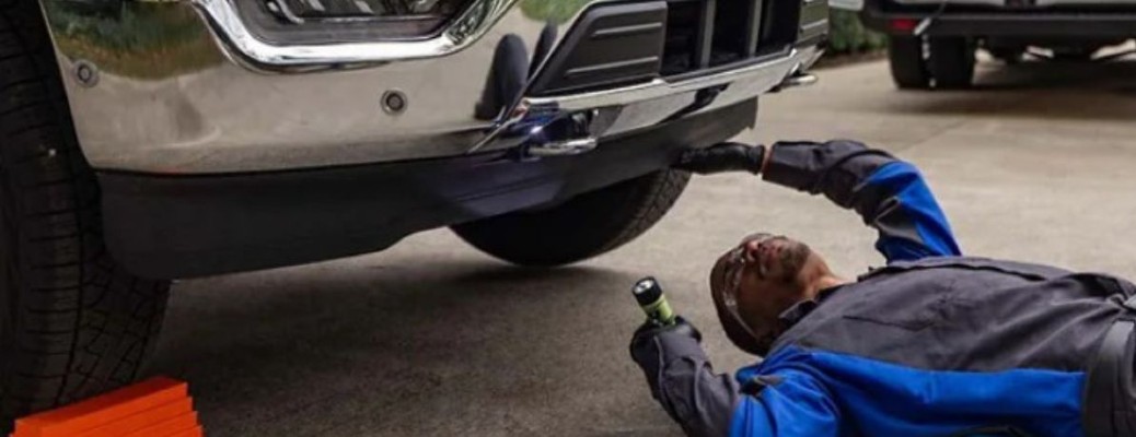 a Ford mobile service technician repairing a Ford truck