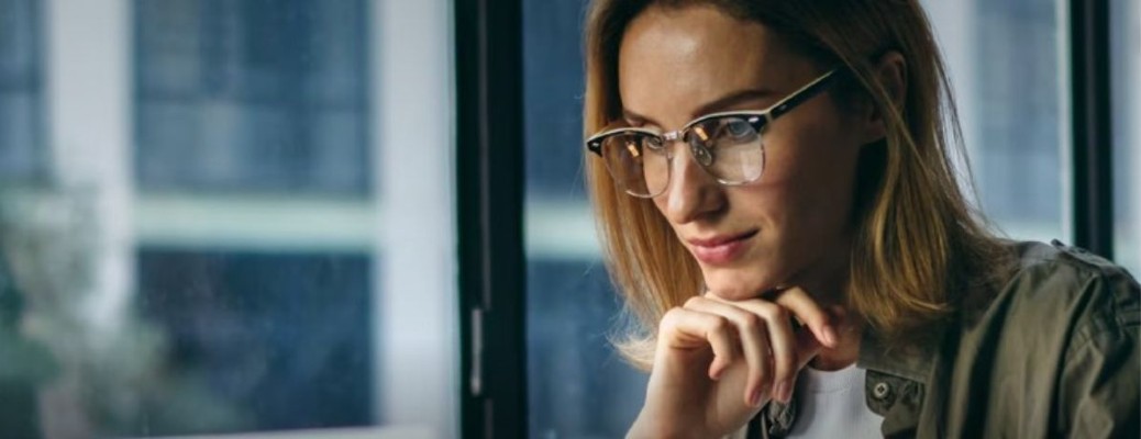 a woman with her hand propped under her chin