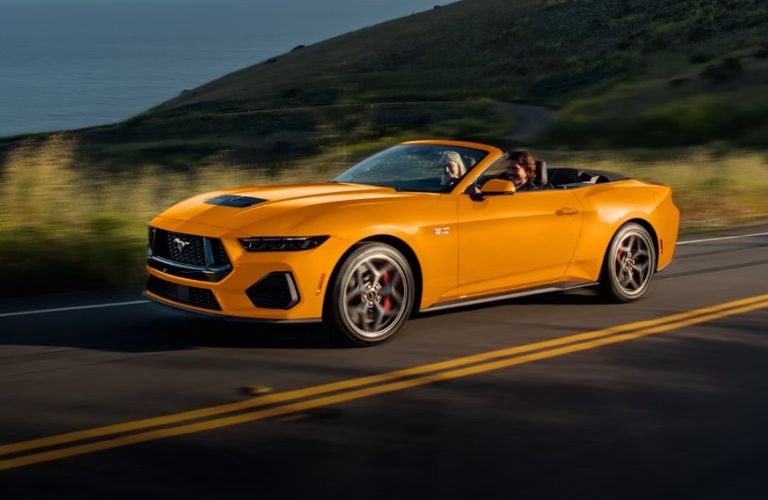 2026 Ford Mustang in orange on a road
