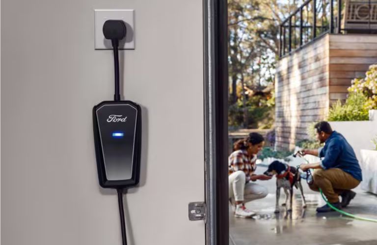 a charging port plugged into a garage outlet