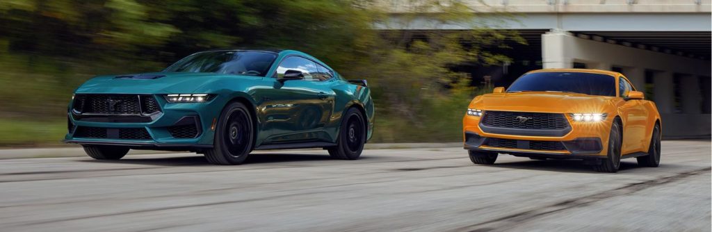 Ford Mustang models on a road