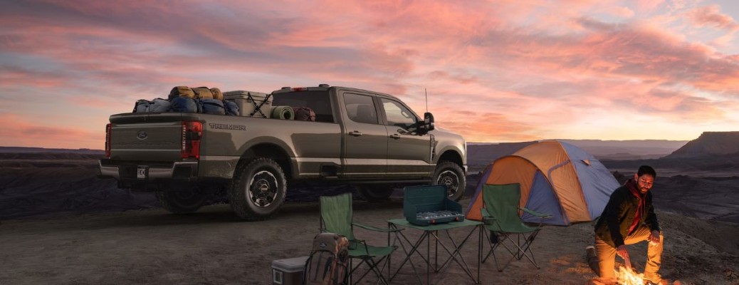 2027 Ford Super Duty parked by a tent