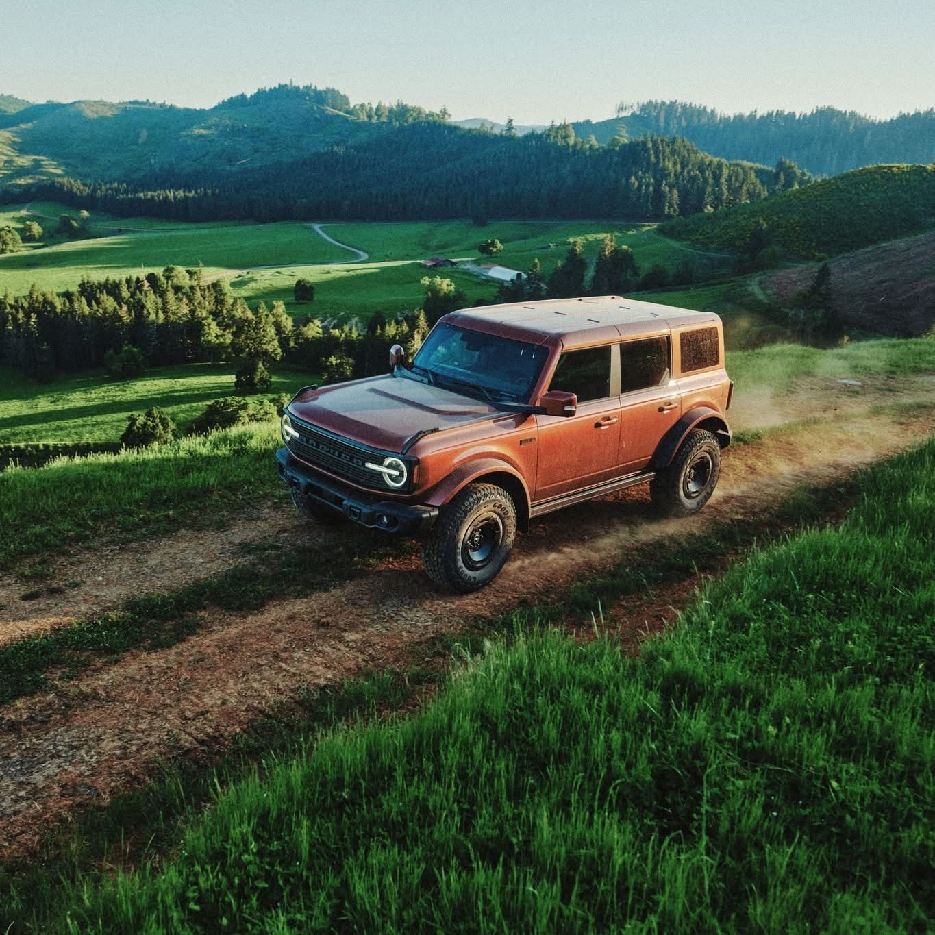 Bronco Filson exploring country side off-road on gravel dirt road, pre-production model