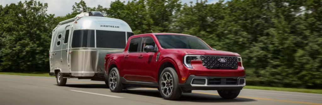 2026 Ford Maverick with red paint towing a trailer