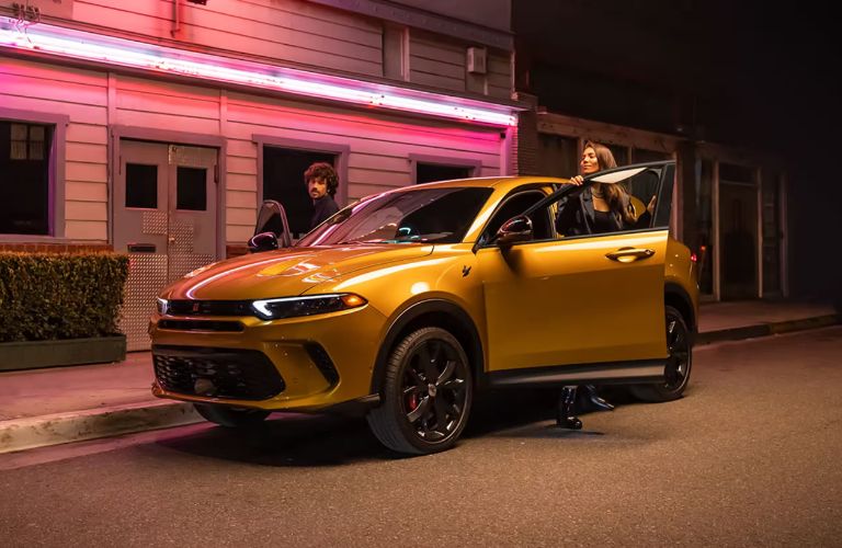 A women getting into the 2025 Dodge Hornet