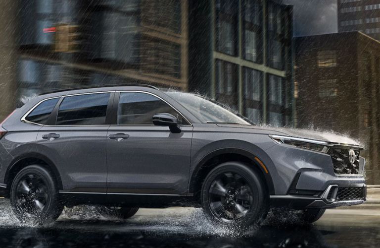 side view of a Honda in rain