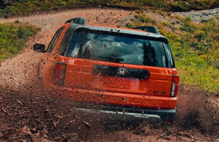 rear view of a Honda in mud