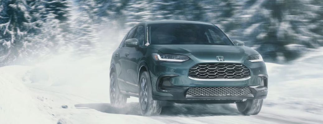 front view of a Honda on a snowy road