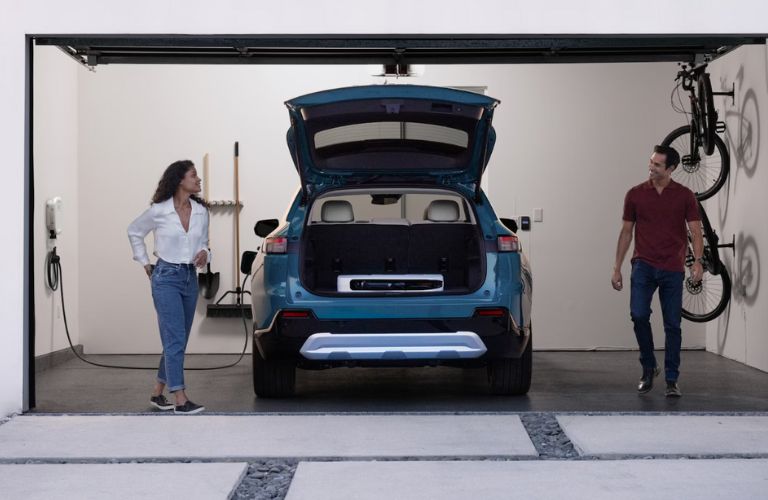 rear view of a Honda EV getting charged at home