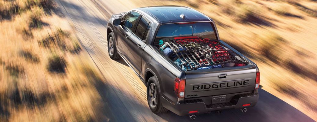 rear view of the 2026 Honda Ridgeline going away on the road
