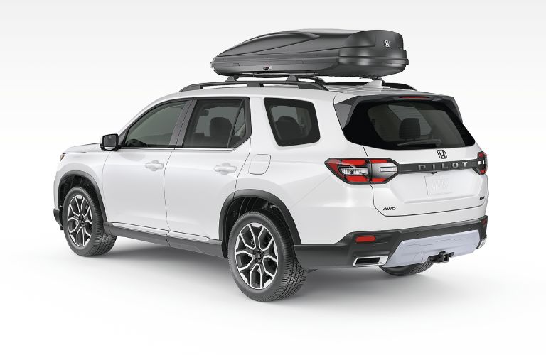 rear and side view of a Honda with a carrier