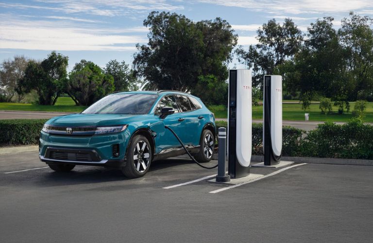 front view of a Honda at a public charging station