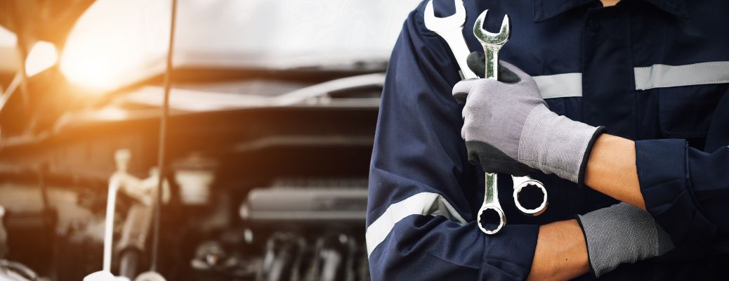 close up of a technician holding tools