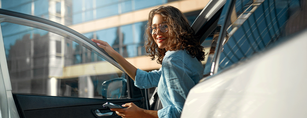 a woman getting out of a car