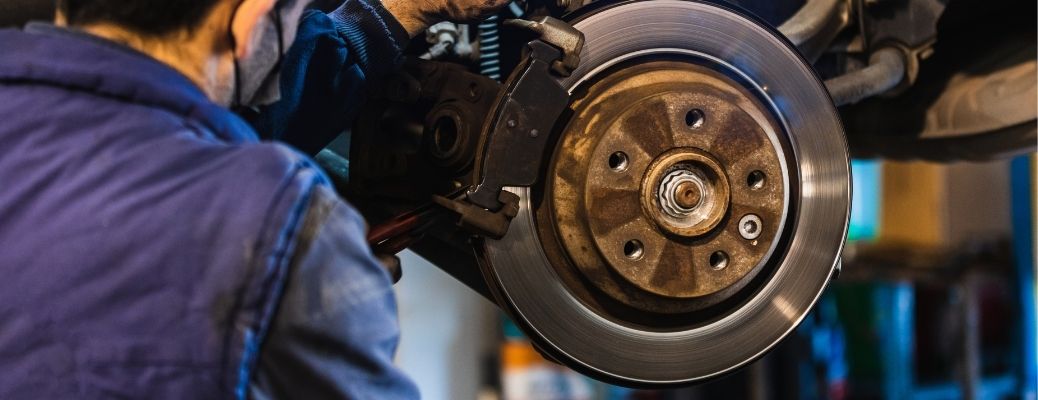Mechanic replacing brake