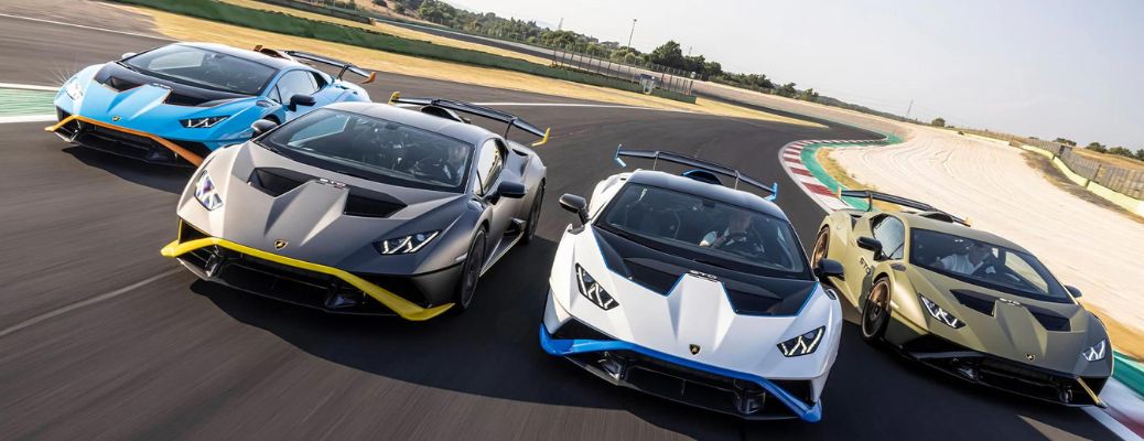Four Lamborghini Huracan STO cars on a race track